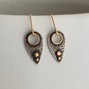 modern dangle earrings with 14k framed circle cut-out and two 14k gold dots