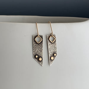 modern artistic dangle earrings in textured sterling silver with 14k gold framed cut-out and 2 gold dots with gold ear wires