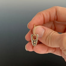 modern artistic sterling earring shown in hand