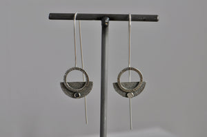 front view of sterling earrings with silver chiseled circle on half circle design